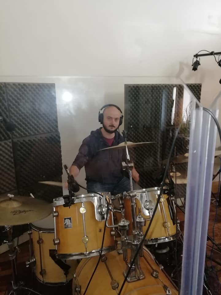 Drummer recording his percussion