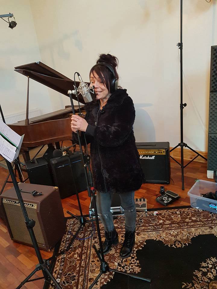 Singer recording a track